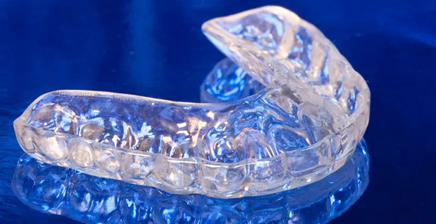 A clear, custom-fitted dental mouthguard